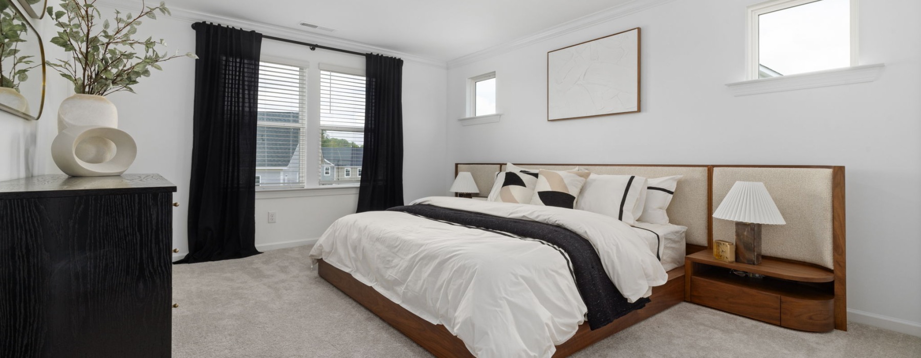 Dog-Friendly Townhomes In Apex, NC - ABODE At Alderwood - Primary Suite Bedroom With Modern Decor And Carpeted Floor.